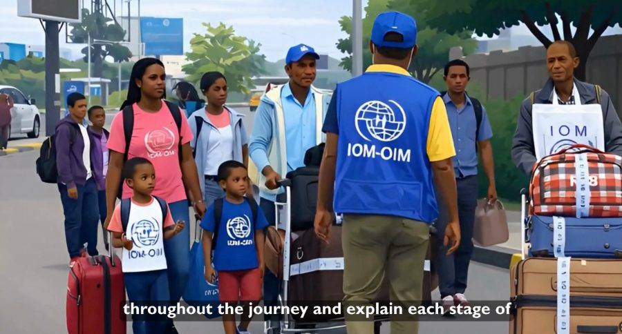 Family walking through the airport with IOM staff